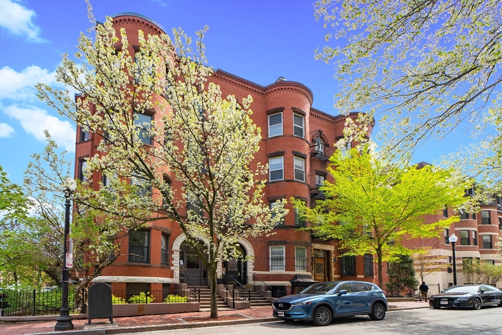 198 St Botolph Street, Unit 2 Boston, MA 02115 - Photo 1 of 10 a building view with lot of cars parked on the roadside