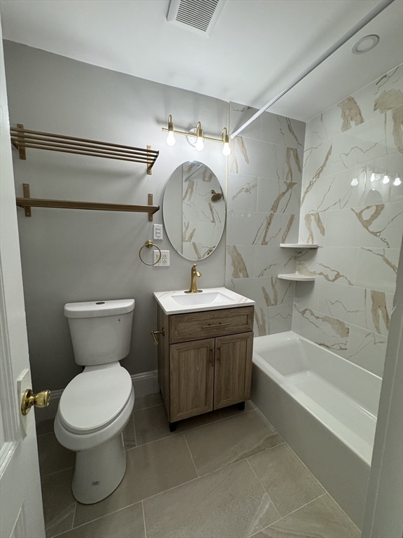 198 St Botolph Street, Unit 2 Boston, MA 02115 - Photo 10 of 10 a bathroom with a toilet a sink and bathtub