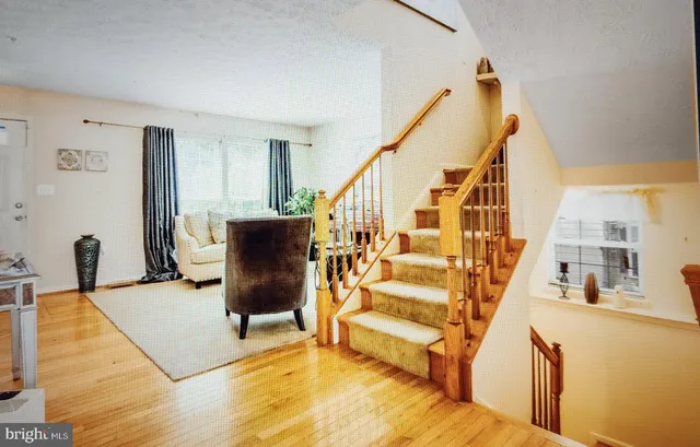 a view of a living room with furniture and a rug
