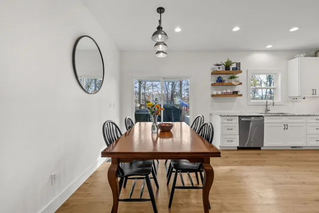 a view of a dining room with furniture and window