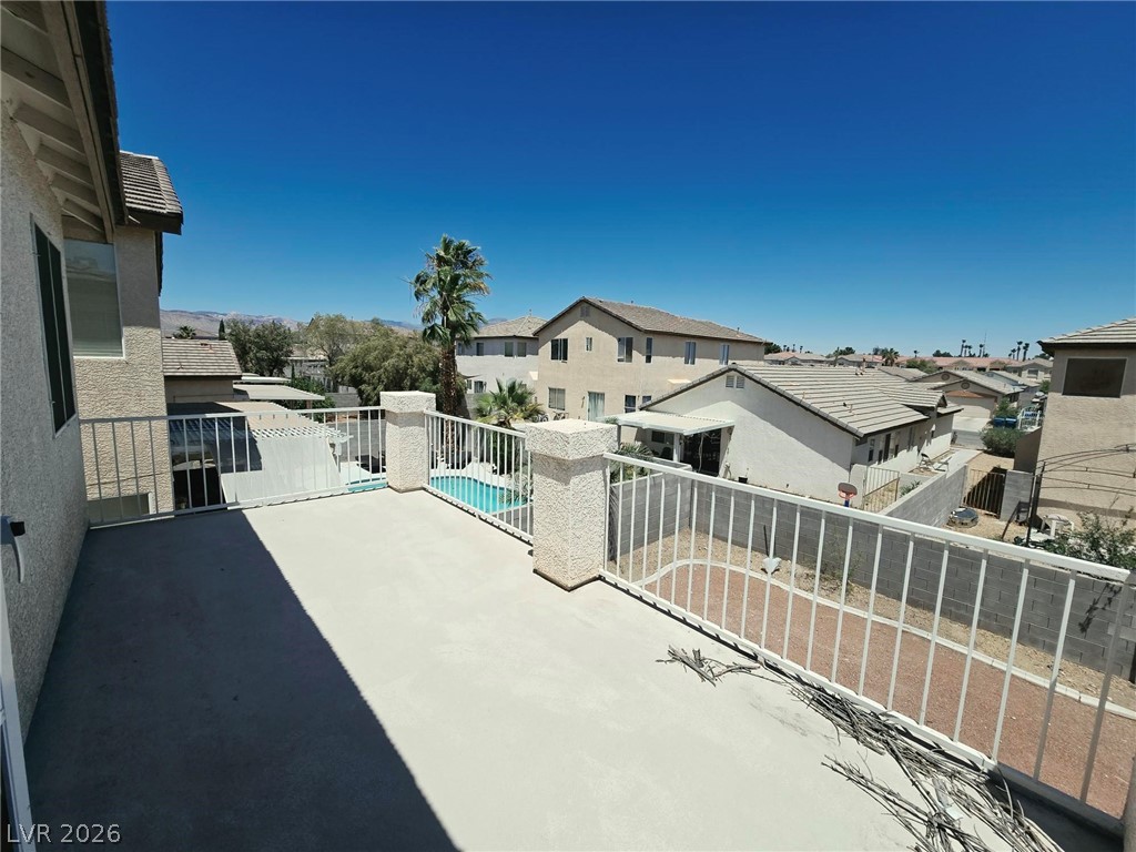 9034 West Rochelle Avenue Las Vegas, NV 89147 - Photo 7 of 8 Enjoy expansive neighborhood views from this generously sized, sun-drenched private balcony.