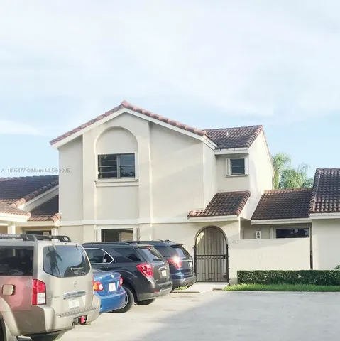 a front view of a house with parking space