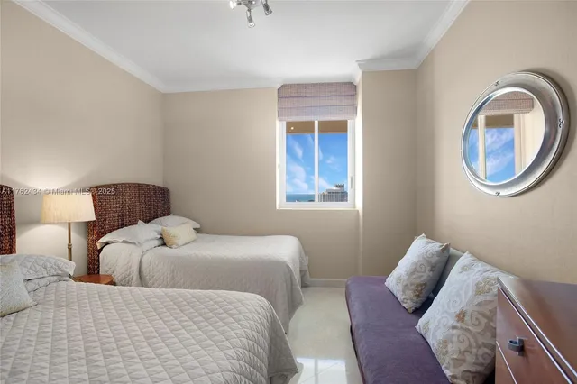 a bathroom with a toilet sink and shower