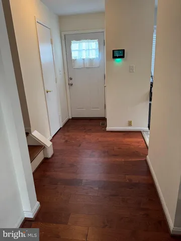 a kitchen with stainless steel appliances granite countertop a refrigerator a sink a stove a washer and dryer