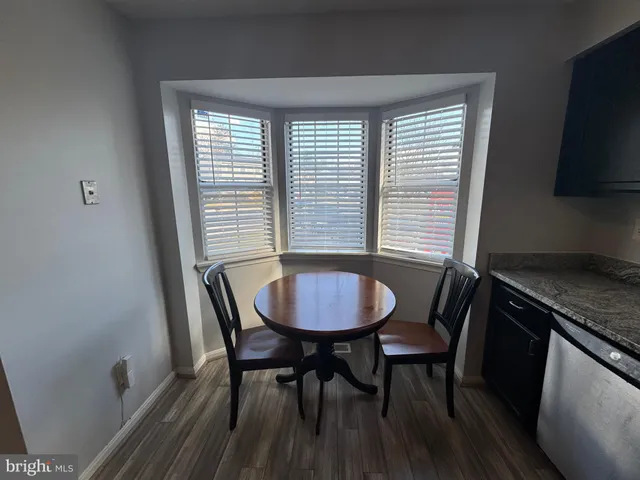 a kitchen with stainless steel appliances granite countertop a stove microwave and oven