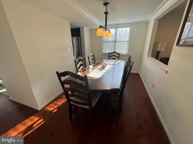 a bed sitting in a bedroom next to a lamp