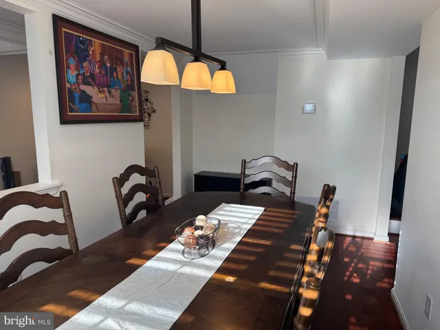 a view of a dining room with furniture and window