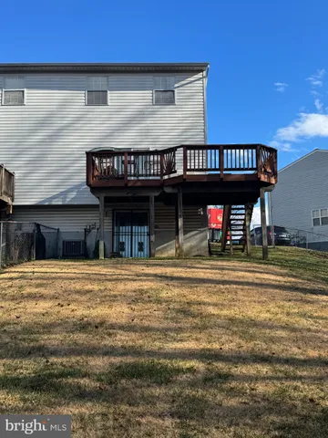 a view of a swimming pool with chair and tables