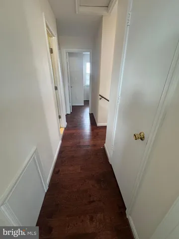 a bathroom with a shower curtain and a toilet