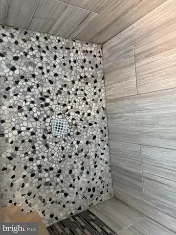 a white toilet sitting next to a bathroom sink