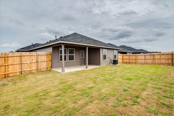 a house view with a backyard space