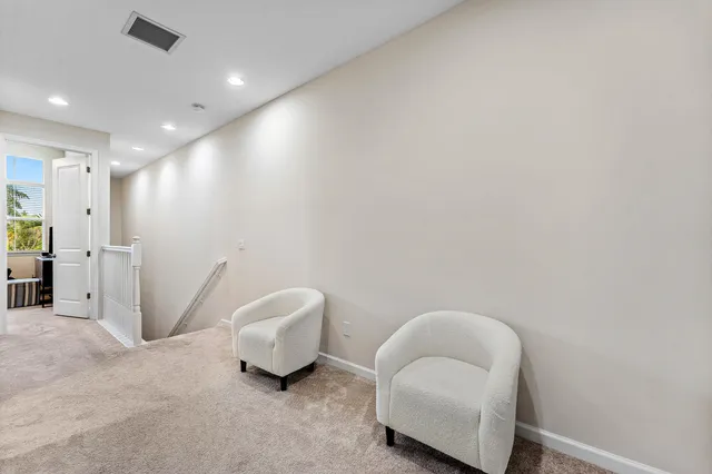 a living room with furniture and a chair