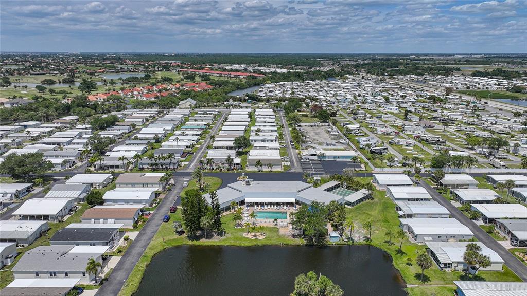 10303 Burnt Store Road, Unit 143 Punta Gorda, FL 33950 - Photo 40 of 42 an aerial view of residential houses with outdoor space