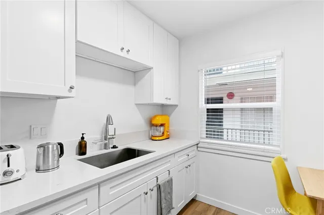 a kitchen with stainless steel appliances kitchen island a stove and a microwave