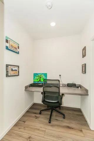 a view of workspace with wooden floor