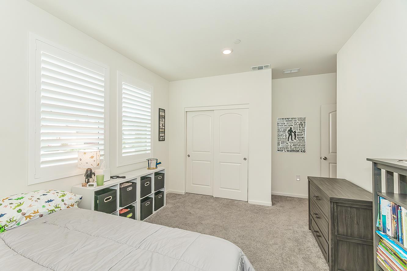 644 Rock Crest Avenue Madera, CA 93636 - Photo 25 of 38 a bedroom with furniture and window