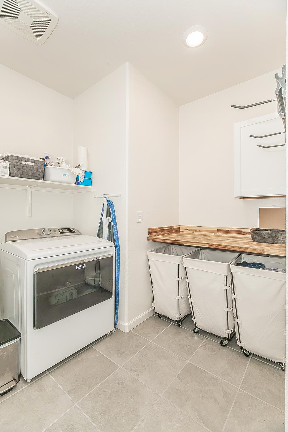 644 Rock Crest Avenue Madera, CA 93636 - Photo 31 of 38 a living room with stainless steel appliances granite countertop a stove and a sink