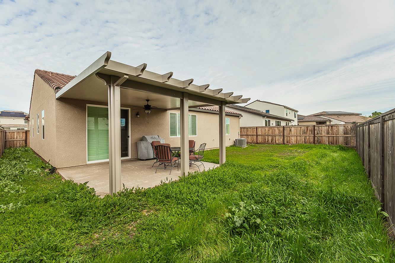 644 Rock Crest Avenue Madera, CA 93636 - Photo 33 of 38 a view of a house with backyard and porch