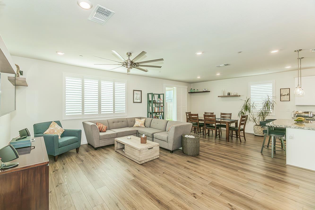 644 Rock Crest Avenue Madera, CA 93636 - Photo 9 of 38 a living room with furniture and wooden floor