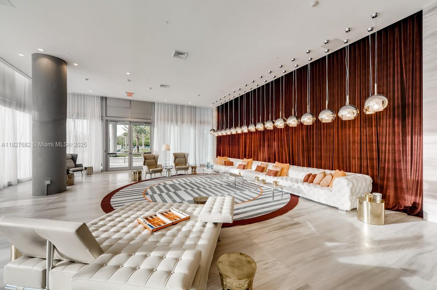 2000 Metropica Way, Unit 1605 Sunrise, FL 33323 - Photo 13 of 43 a spacious bedroom with a bed and window