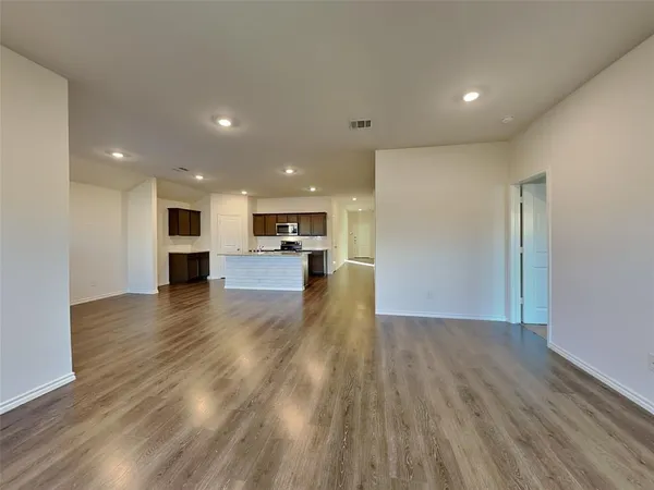 a view of kitchen with cabinets and wooden floor