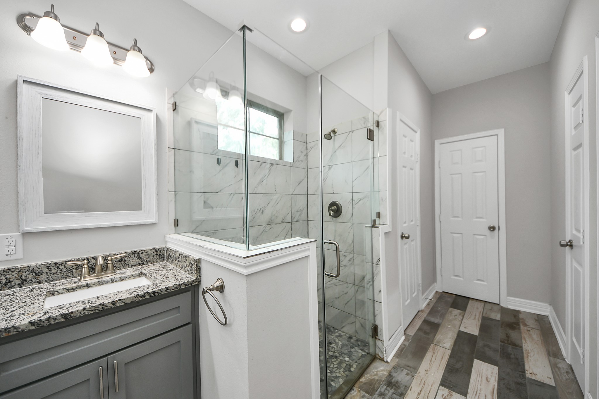 25450 Killarney Road Hempstead, TX 77445 - Photo 14 of 34 a bathroom with a granite countertop sink mirror and double