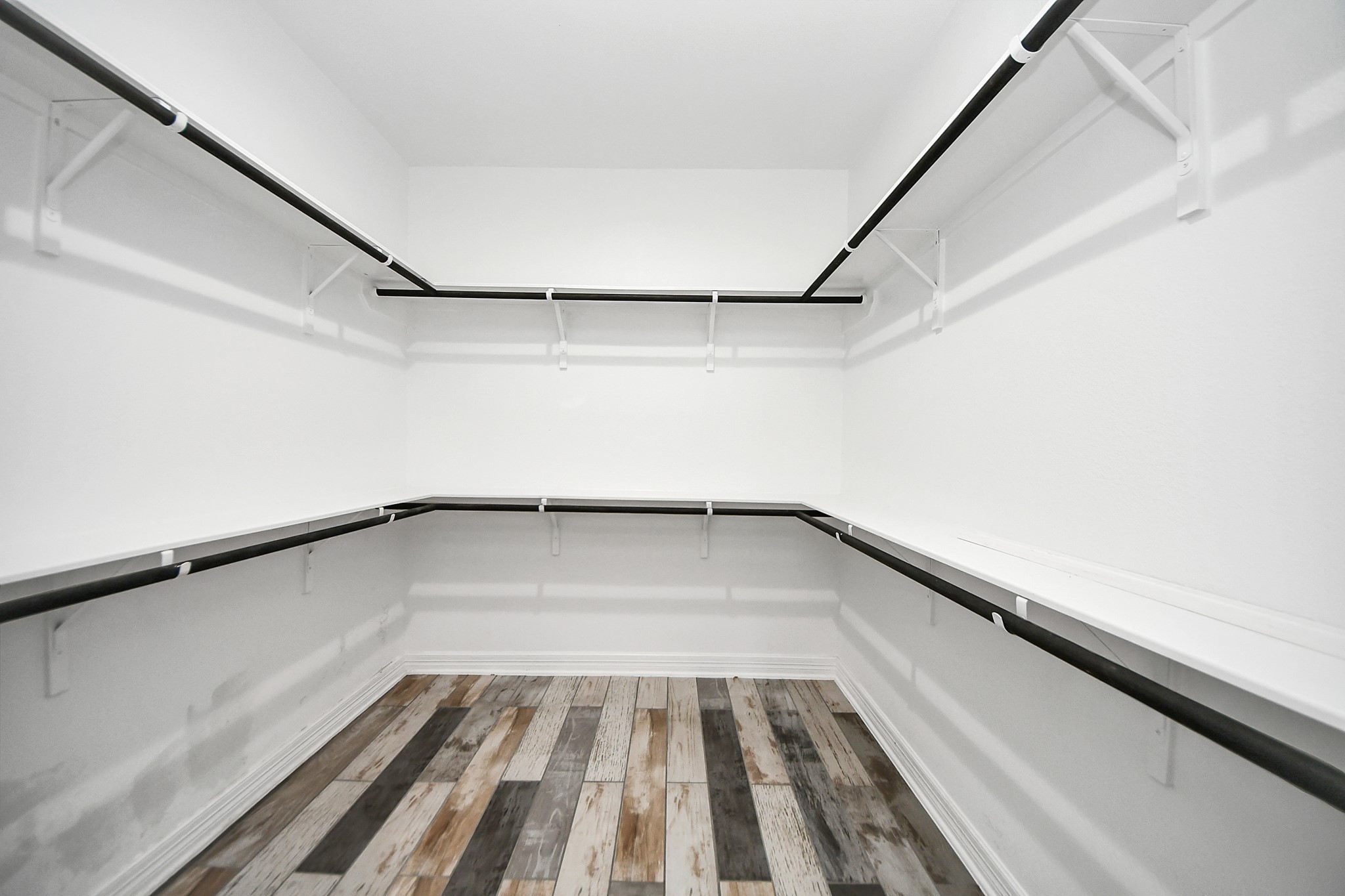 25450 Killarney Road Hempstead, TX 77445 - Photo 15 of 34 a view of a room with wooden floor and staircase