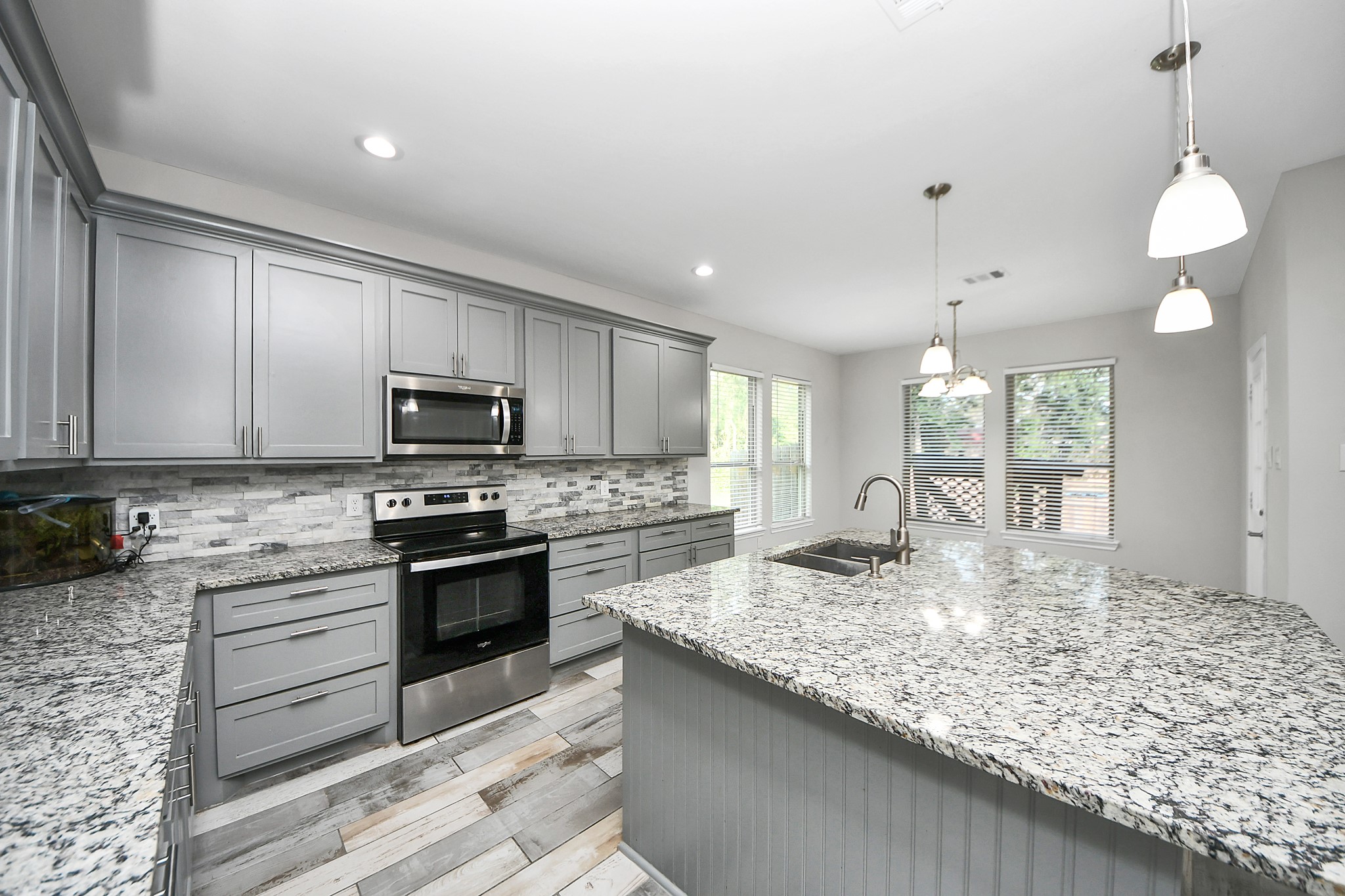 25450 Killarney Road Hempstead, TX 77445 - Photo 22 of 34 a kitchen with sink stove and cabinets