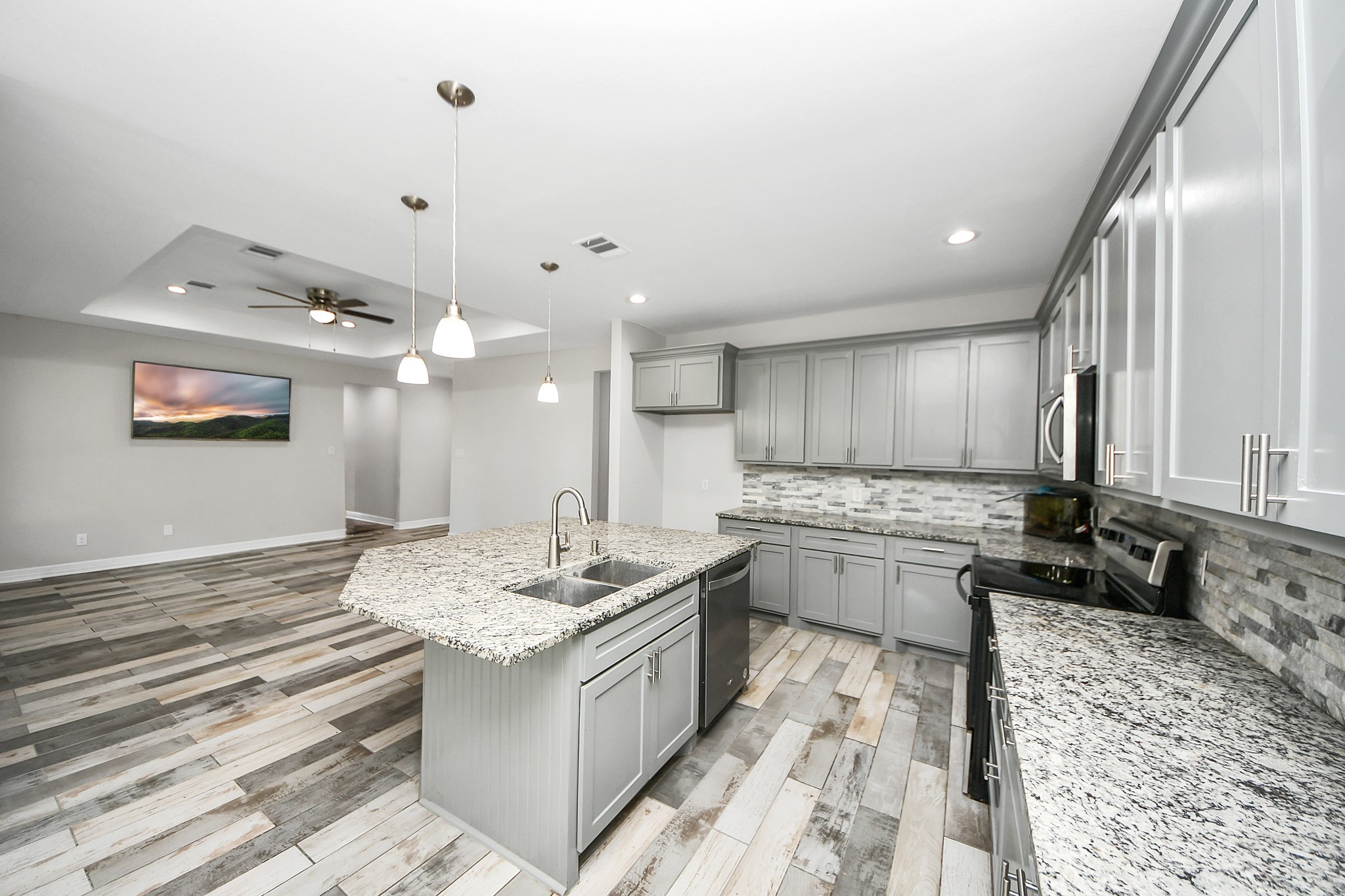 25450 Killarney Road Hempstead, TX 77445 - Photo 24 of 34 a large kitchen with kitchen island a sink stainless steel appliances and cabinets