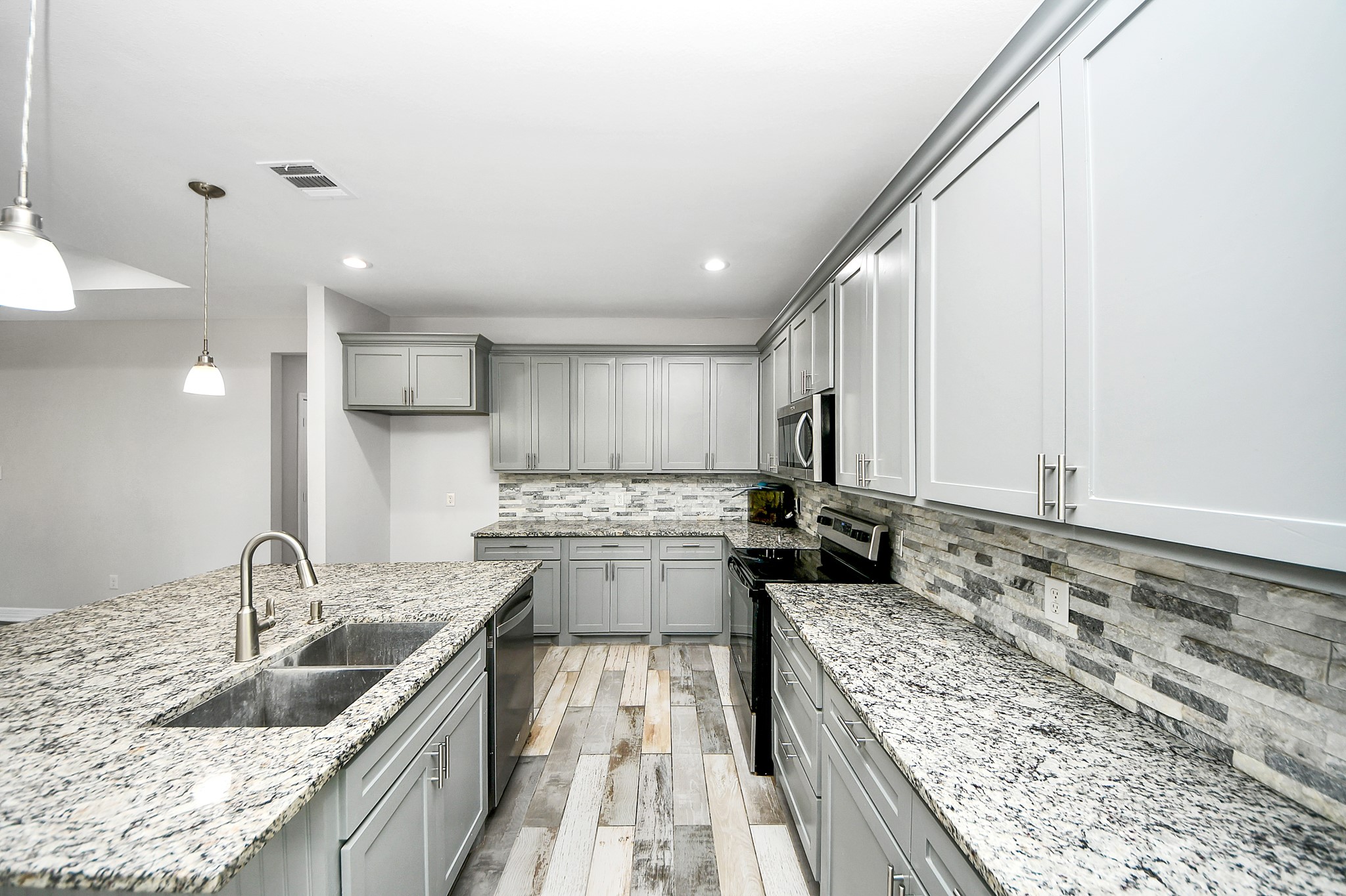25450 Killarney Road Hempstead, TX 77445 - Photo 25 of 34 a kitchen with stainless steel appliances granite countertop a sink stove and refrigerator