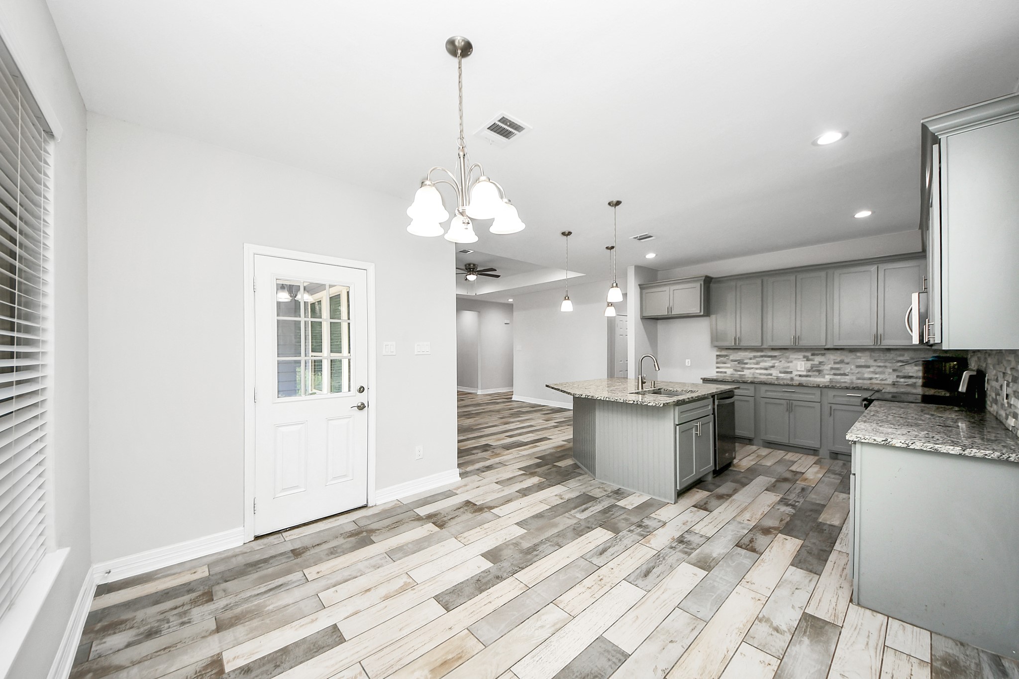 25450 Killarney Road Hempstead, TX 77445 - Photo 27 of 34 a kitchen with a white stove top oven and cabinets