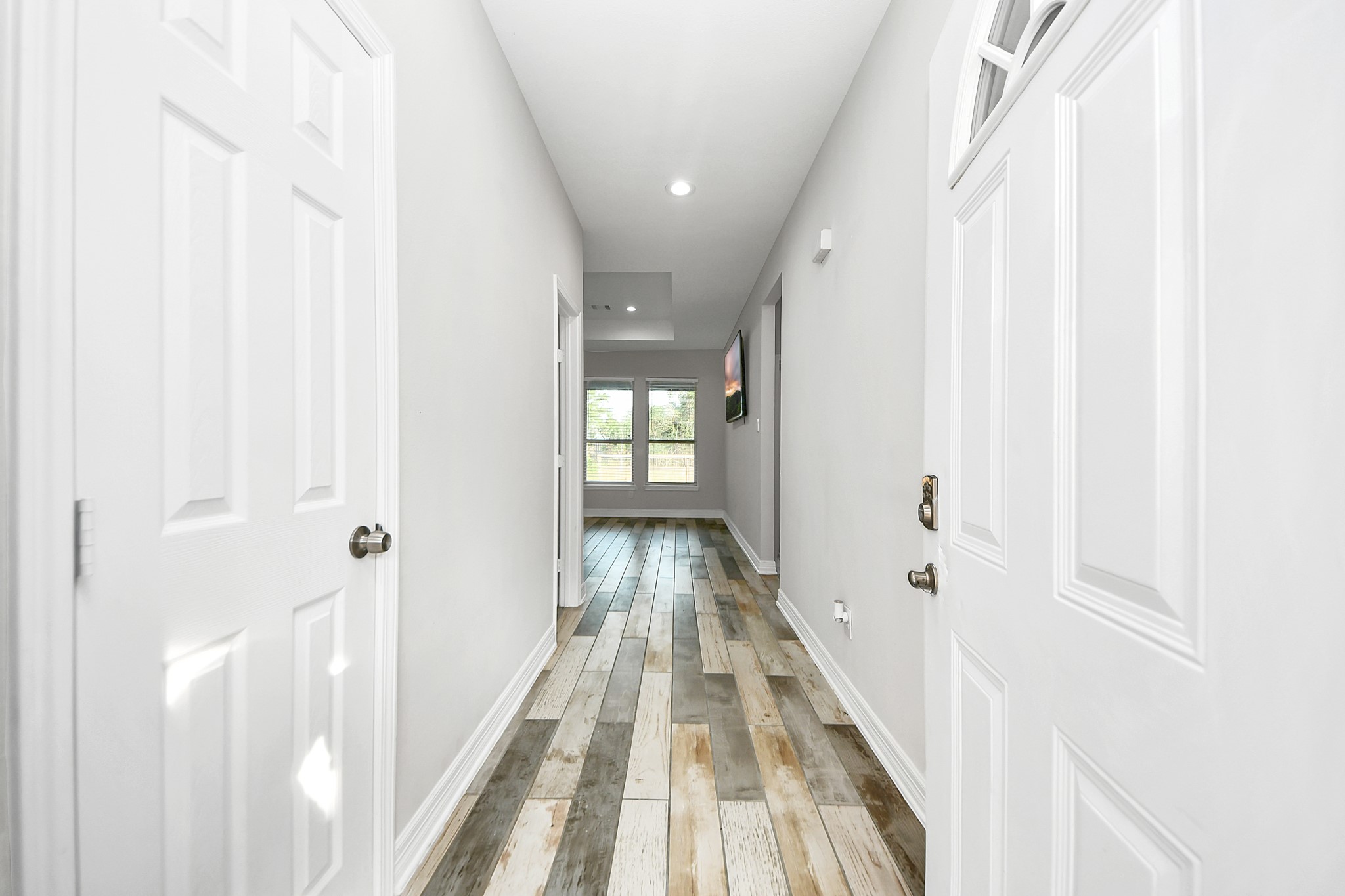 25450 Killarney Road Hempstead, TX 77445 - Photo 3 of 34 a view of a hallway with wooden floor and staircase