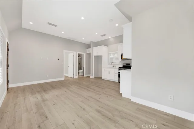 a view of kitchen with refrigerator and window