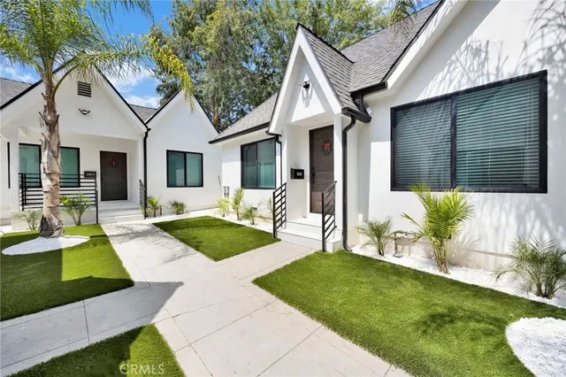 a front view of a house with garden