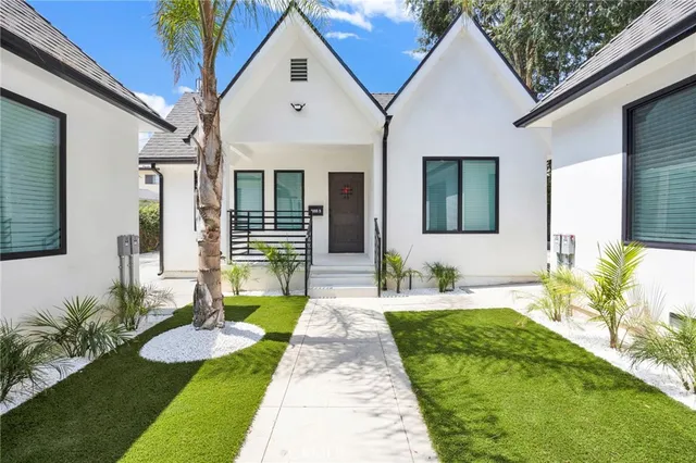 a front view of a house with garden
