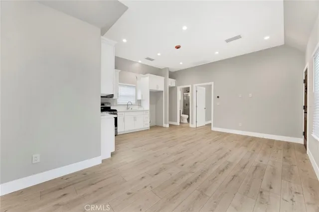 a view of a kitchen with wooden floor