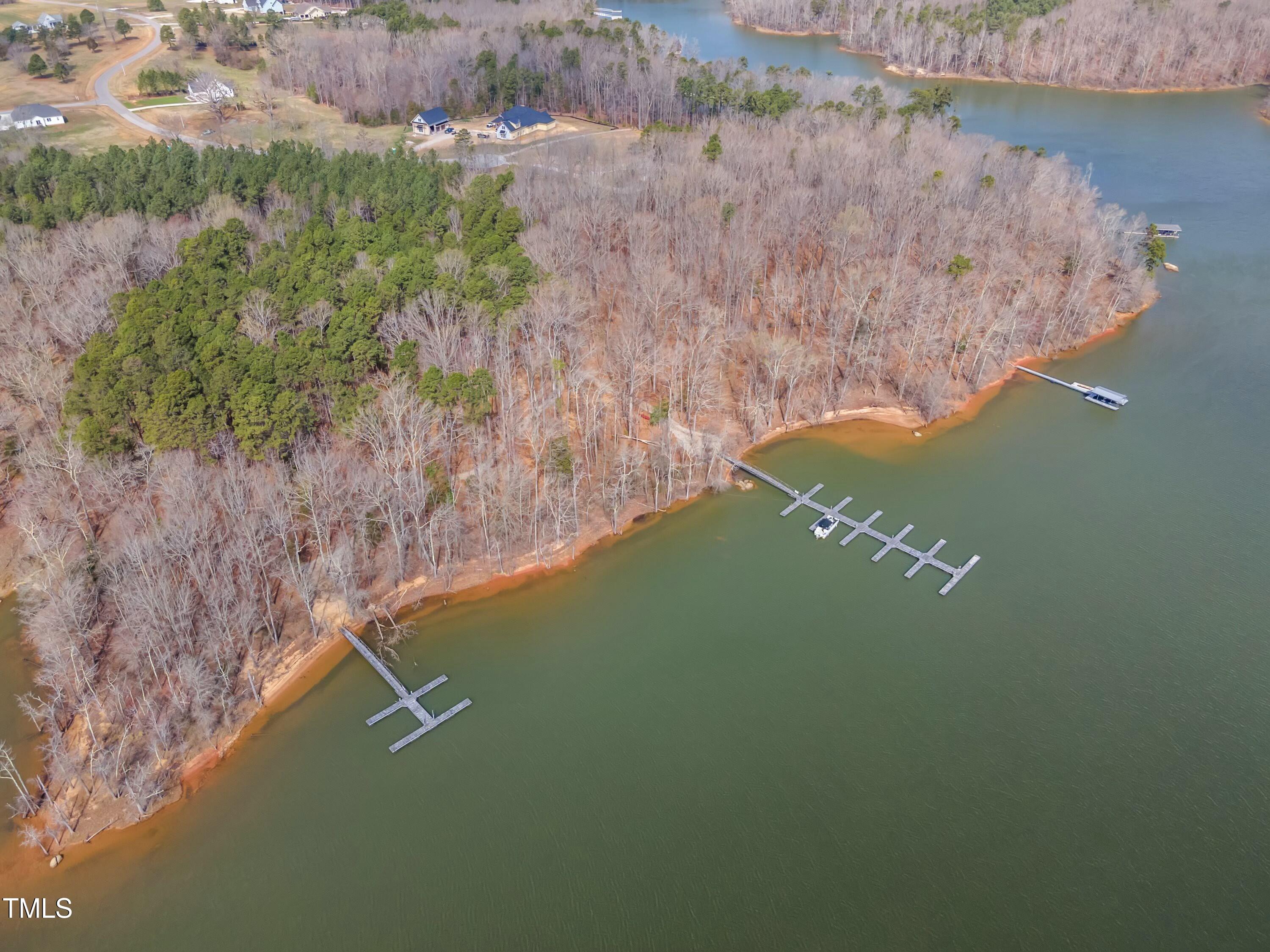 33 Waterstone Lane Henderson, NC 27537 - Photo 16 of 17 a view of a lake from a yard