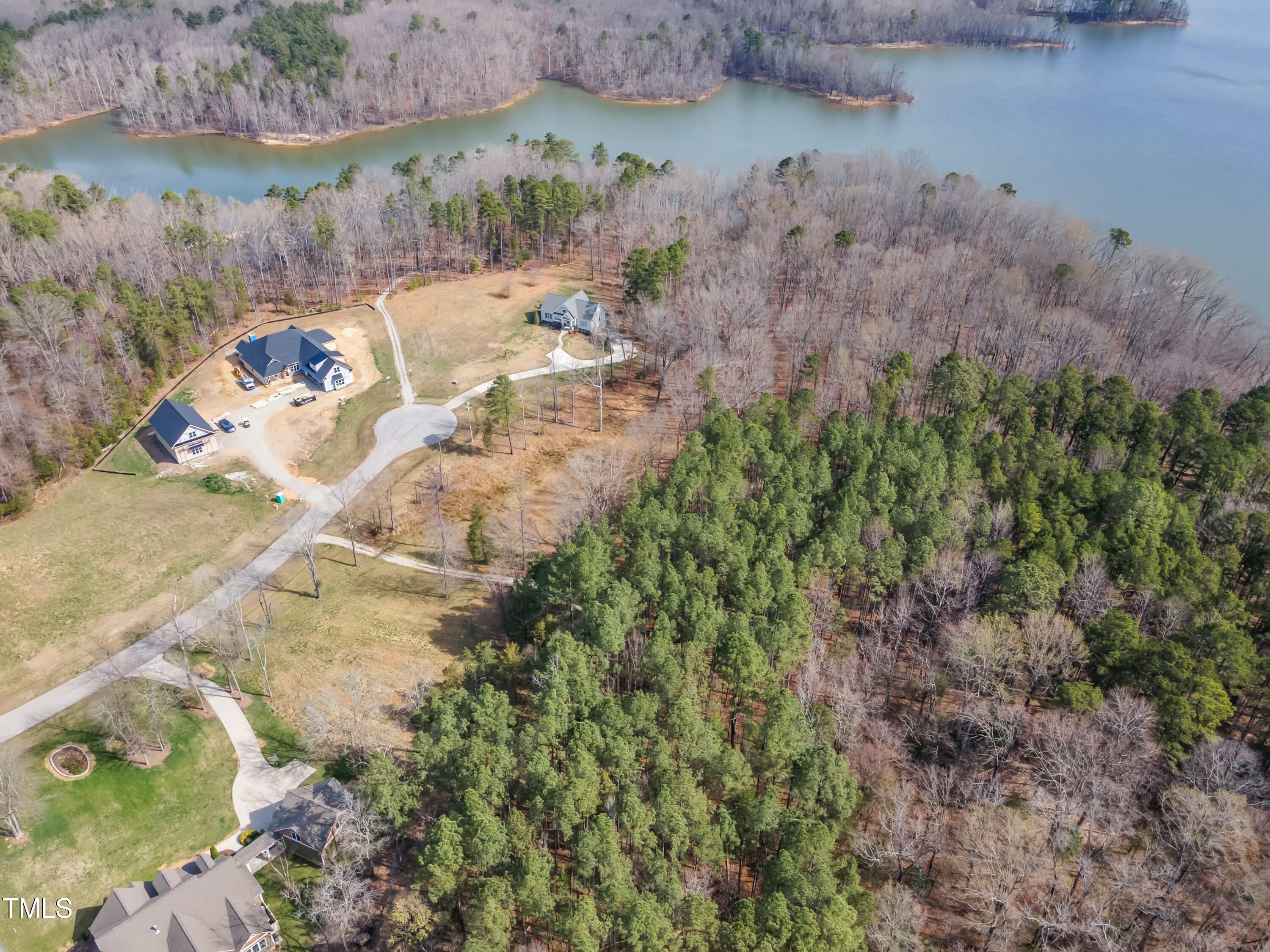 33 Waterstone Lane Henderson, NC 27537 - Photo 9 of 17 a view of a lake with a yard