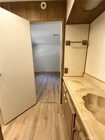 a room with a sink and a mirror