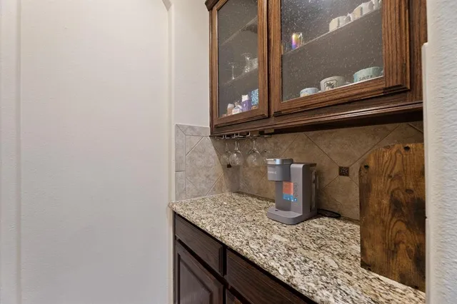 a kitchen with stainless steel appliances granite countertop a stove and a refrigerator