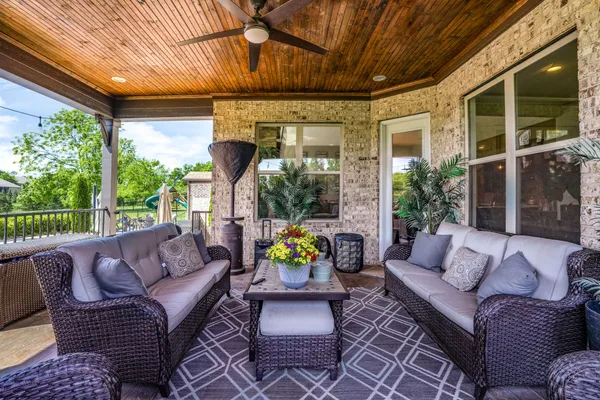 an aerial view of a house with a yard basket ball court and outdoor seating