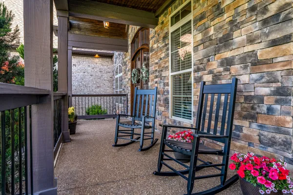 a kitchen with stainless steel appliances granite countertop wooden cabinets a stove top oven a sink and dishwasher