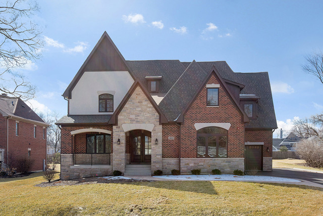 1851 Beechnut Road Northbrook, IL 60062 - Photo 2 of 40 a front view of a house with large yard