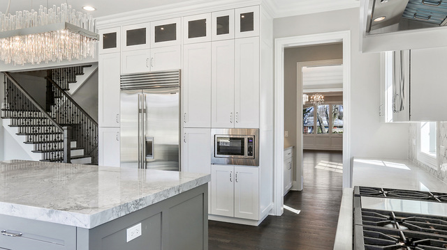 1851 Beechnut Road Northbrook, IL 60062 - Photo 11 of 40 a kitchen with stainless steel appliances kitchen island granite countertop a stove and a sink