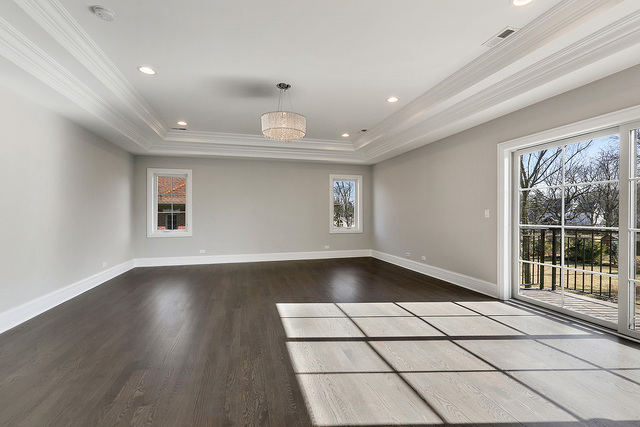 1851 Beechnut Road Northbrook, IL 60062 - Photo 19 of 40 a view of empty room with wooden floor and fan