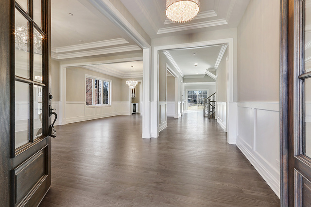 1851 Beechnut Road Northbrook, IL 60062 - Photo 3 of 40 a view of a hallway view with floor to ceiling window and kitchen view