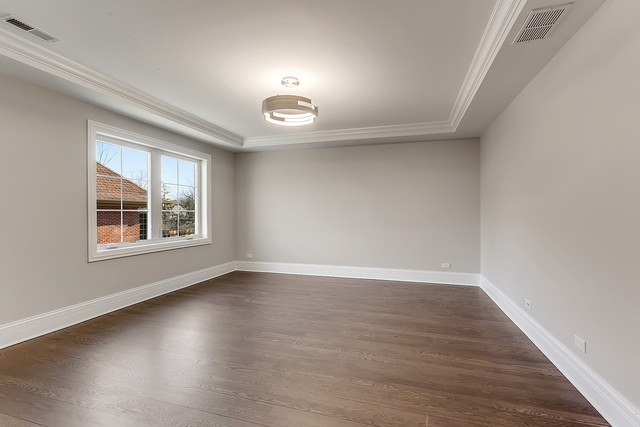 1851 Beechnut Road Northbrook, IL 60062 - Photo 26 of 40 wooden floor in an empty room with a window