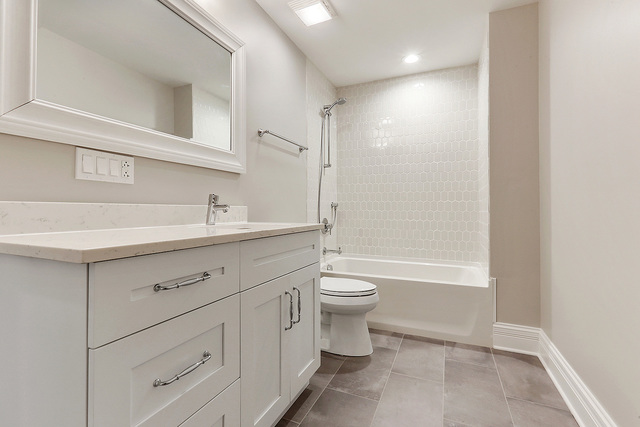 1851 Beechnut Road Northbrook, IL 60062 - Photo 28 of 40 a bathroom with a sink a toilet and shower