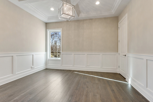 1851 Beechnut Road Northbrook, IL 60062 - Photo 29 of 40 an empty room with wooden floor cabinet and windows
