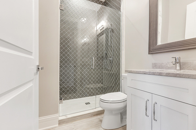 1851 Beechnut Road Northbrook, IL 60062 - Photo 30 of 40 a bathroom with a shower toilet and sink